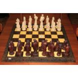 Ornate chess set with classical figure pieces.