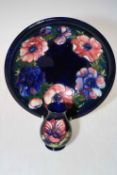 Moorcroft bowl decorated with anemone on blue ground, 25cm diameter,