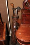 Vintage leather golf bag and hickory clubs.