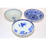 Three blue and white Oriental bowls.