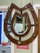 Horseshoe shaped six hook mirror coat rack.