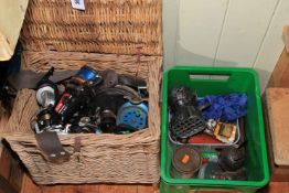 Wicker fishing basket containing various reels, American Honey boxes, etc.