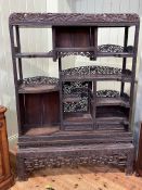 19th Century Chinese carved rosewood and fretwork open display cabinet on stand,