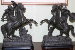 Pair of spelter warriors on horseback.