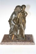 Ornate cast metal figure of a couple on marble base.