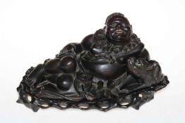 Ornate carved Oriental elder with boar, 20cm high.