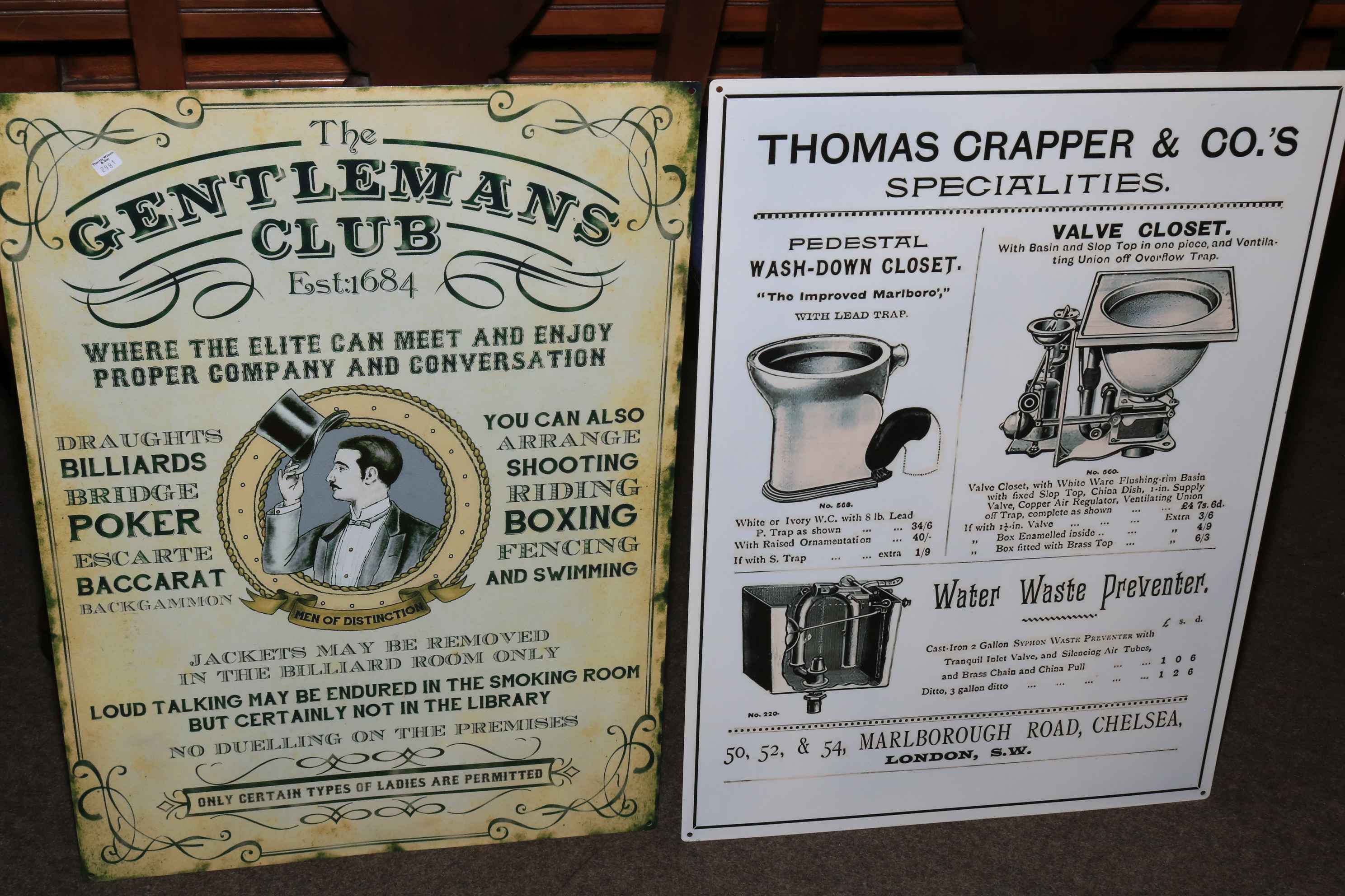 Two advert signs 'The Gentlemen's Club' and 'Thomas Crapper and Co's'.
