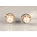 Pair Mappin and Webb white gold pearl and diamond stud earrings, pearls approximately 8mm diameter