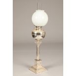 Electro plated silver paraffin lamp, Corinthian column with applied lion masks, converted to