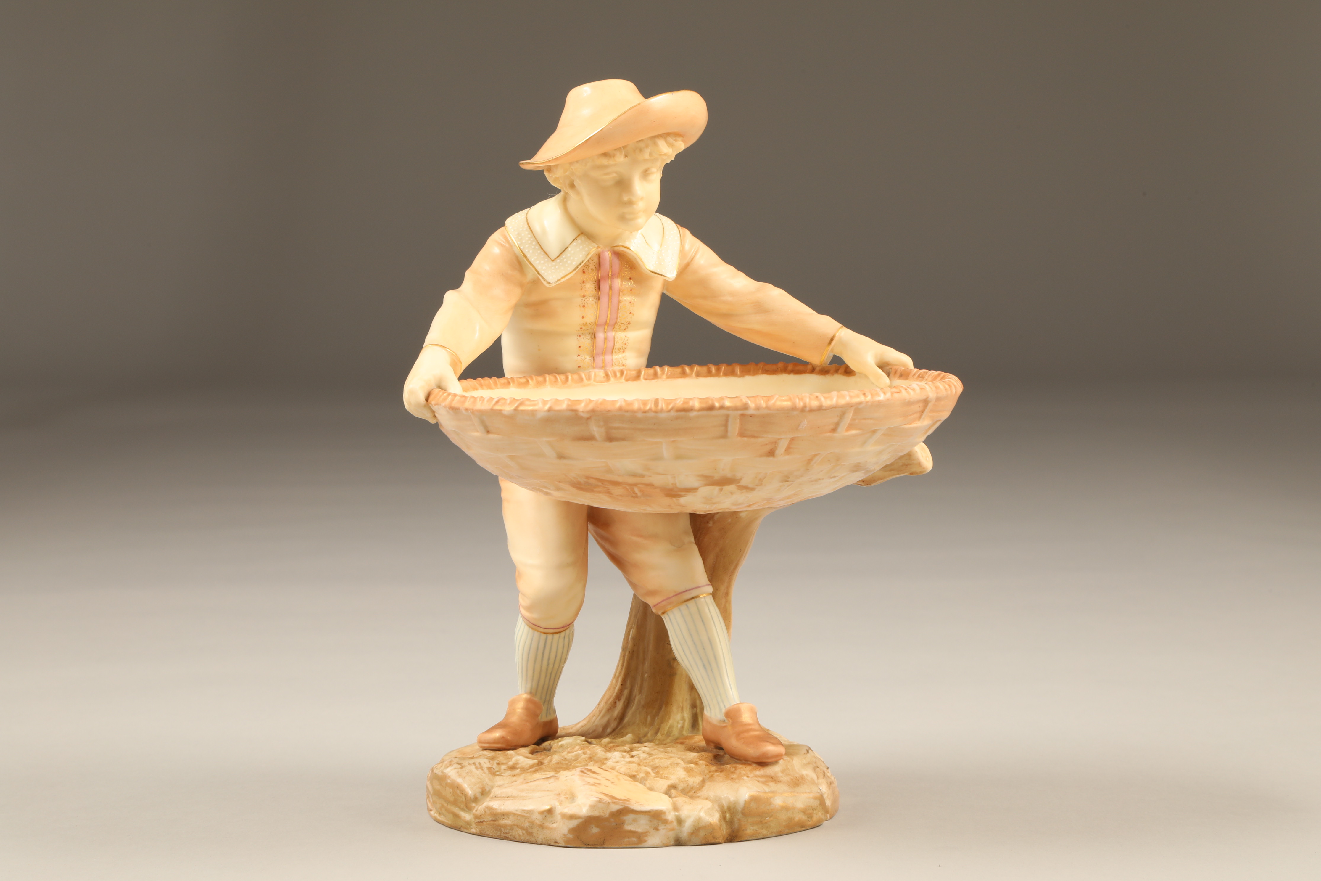 Royal Worcester figure, boy holding a large basket, signed Hadley, date coded 1886 Height 23cm - Image 2 of 4