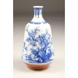 A Chinese blue and white painted porcelain bottle vase, the neck decorated with sprays of flowers,