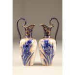 Pair of Doulton Burslem ewers, baluster form, with scroll handle, blue and white decorated with