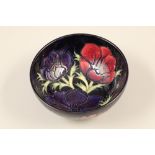 Moorcroft pottery bowl, dark blue ground decorated with anemone pattern Diameter 16cm, height 7cm