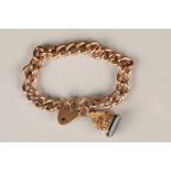Ladies 9 carat rose gold curb link bracelet, with heart clasp with 9 carat gold fob pendant with