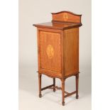 Edwardian inlaid mahogany music cabinet, inlaid lyre to panelled door revealing a shelved