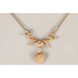 Edwardian 9 carat gold and pearl seed necklace, with a suspending pearl seed encrusted heart