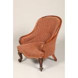 Victorian rosewood arm chair, arched back with sweeping carved scaled elbows, raised on scroll
