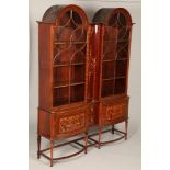 Edwardian double arched inlaid mahogany display cabinet, moulded cornice, central concave inlaid