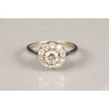 Platinum diamond cluster ring, central 0.33 carat diamond surrounded by ten 0.05 carat diamonds,