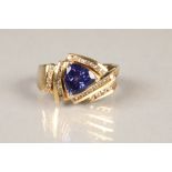 Ladies 18 carat yellow gold tanzanite ring, with five rows of small diamonds , ring size P/Q