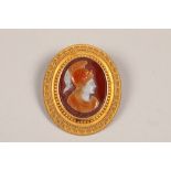 19th century unmarked gilt metal mounted carved hardstone brooch/with pendant mount, oval form neo-