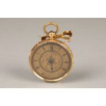 Ladies 18 carat gold open faced pocket watch, engraved floral dial with Roman numerals, hour markers