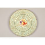 Royal Worcester cabinet plate, painted with a central panel of fallen fruit, within a pale blue