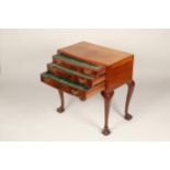 Mahogany three drawer canteen table, raised on cabriole legs with ball and claw feet. Each drawer