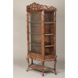 19th/20th century Chinese hongmu faux bamboo display cabinet on stand, the top with central crest