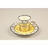 Boxed Aynsley twelve piece coffee set. Yellow coffee cans and saucers with pierced silver liners