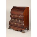 19th century bombe shaped mahogany bureau, cylinder top revealing a fitted interior over three