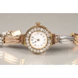 Boxed ladies 18 carat rose gold wristwatch, with white and rose gold bracelet strap, white