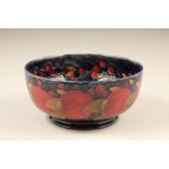 Moorcroft pottery bowl, in the pomegranate pattern, signed to the base in green Height 10cm,