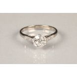 Ladies diamond solitaire ring, central stone one carat, with diamond shoulders, in platinum mount,