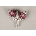 Ruby and diamond floral double clip brooch, comprising of two ruby flower heads, claw set with