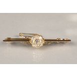 Ladies old cut diamond cluster bar brooch, mounted on yellow metal, central diamond surrounded by