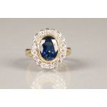 18K gold sapphire and diamond ring, central blue oval cut sapphire approximately 2.5 carats,