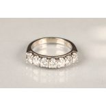 Ladies 18 carat white gold seven stone diamond ring, seven 0.2 carat brillant cut diamonds, ring