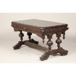 Dark oak library table , with frieze drawer with carved masks, cross stretcher supported on four