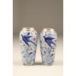 Pair of small silver topped porcelain vases, decorated with flowers and flying birds, silver assay