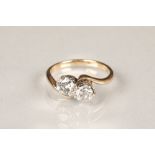 Ladies two stone diamond ring, cross over setting with two approximately 0.5 carat brilliant cut