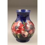 Moorcroft pottery vase, baluster form decorated with anemone pattern, original paper label,