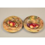 Pair of Royal Worcester plates, decorated with hand painted fallen fruit, signed Mosely, date