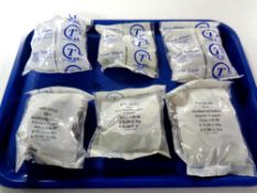 A tray containing six bags of unused travel tokens issued by East North Hamptonshire