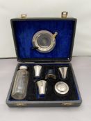 A seven piece travelling communion set comprising of silver tray and lidded pot,