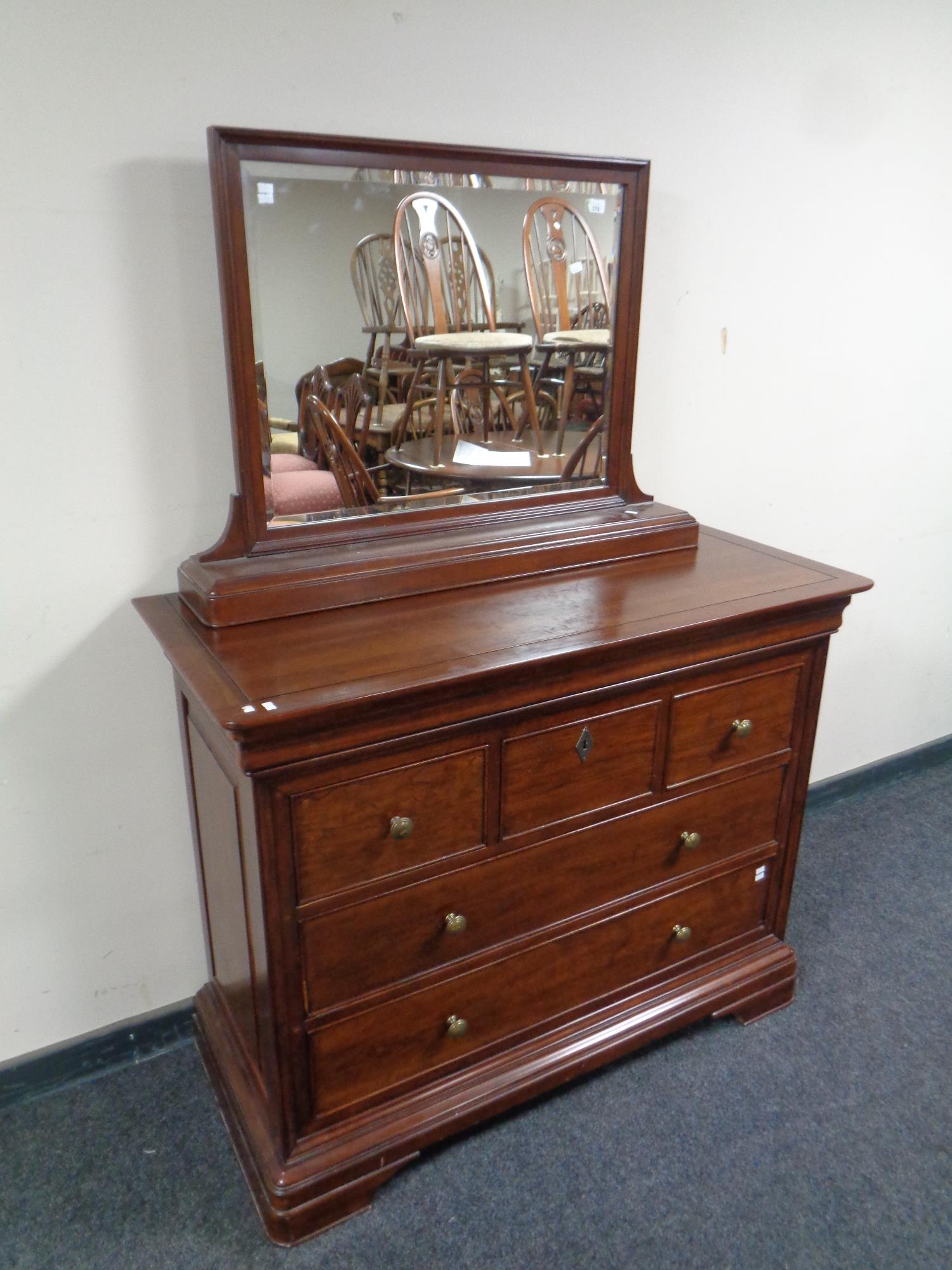 A John Lewis five drawer dressing chest in a mahogany finish