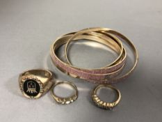 A five piece bracelet set, together with chunky gold plated ring with Crown signet,