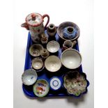 A tray containing a quantity of antique oriental wares to include teapot, tea bowls,