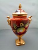 A Coalport gilded lidded vase painted with fruit by Neil Higgins, height 21.