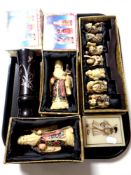 A tray of boxed ceramic and resin Japanese figures together with a lidded trinket box and a vase